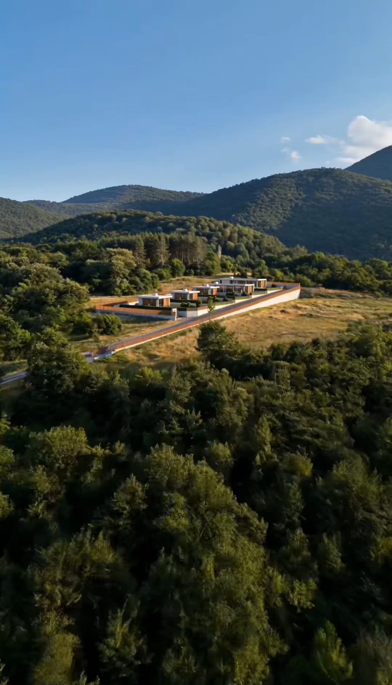 The estate above the forested hills